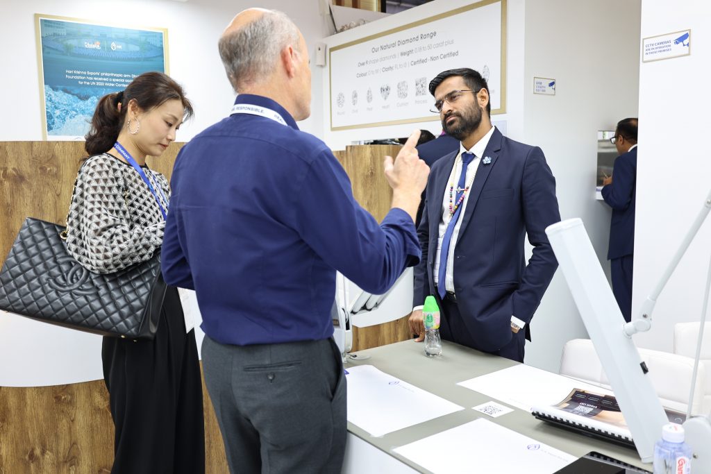 Brijesh Dholakia, CEO of Hari Krishna Exports, at Hong Kong Show, providing top-of-the line service to customers